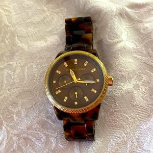 Michael Kors animal print watch with gold accents.  Excellent condition.